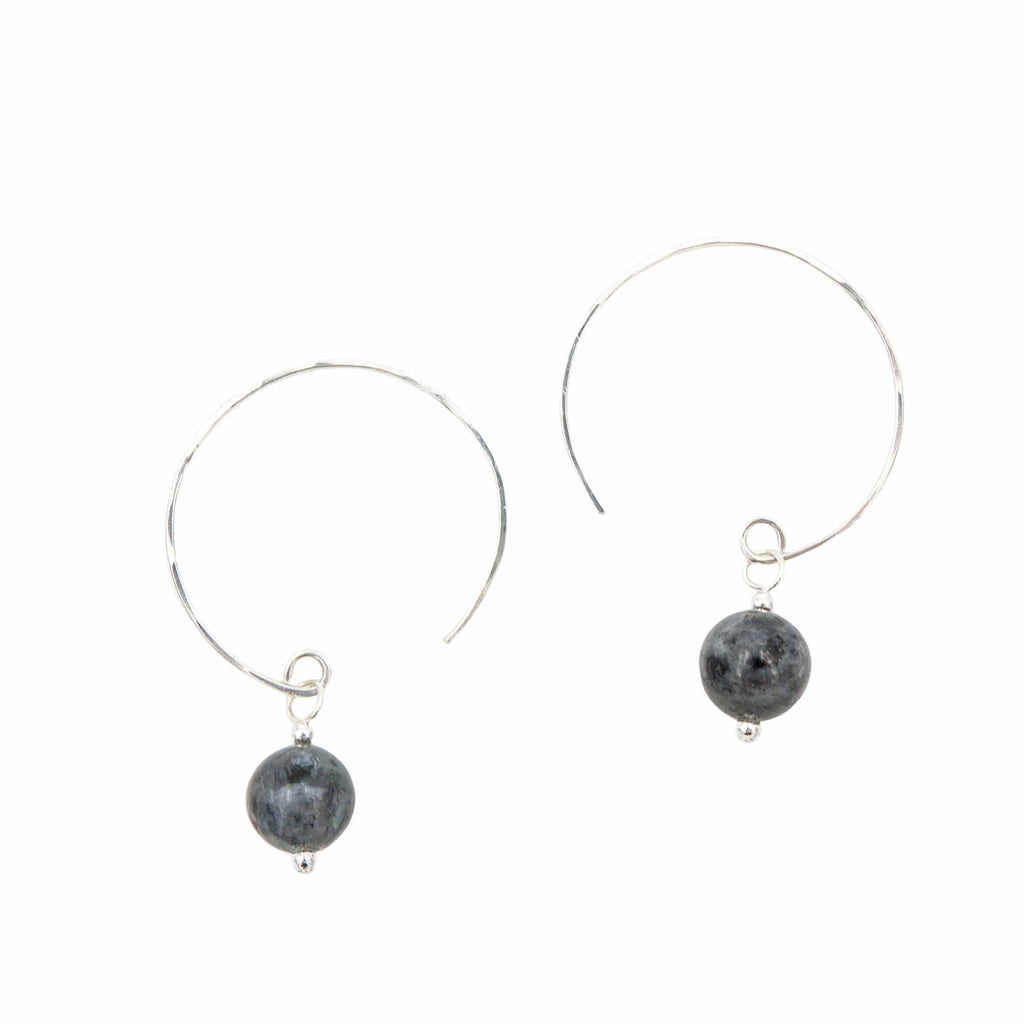 Iridescent Larvikite Hoop Curves